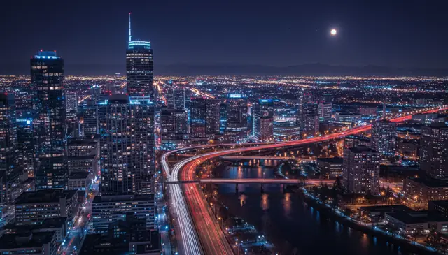 AI photo sharpening producing crisp cityscape at night with detailed building edges