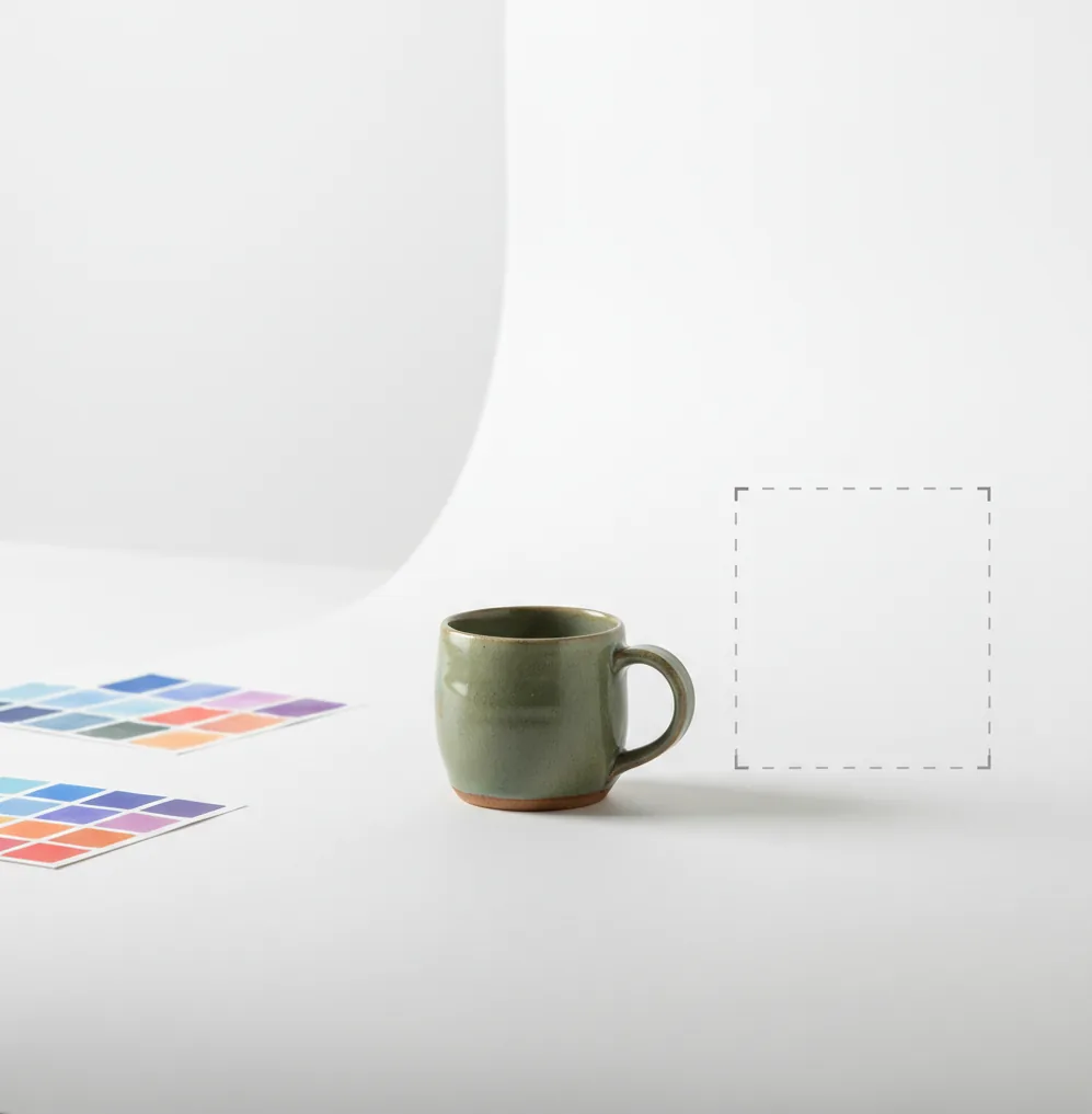 Hand holding a small product on white backdrop with soft shadows and crisp edges