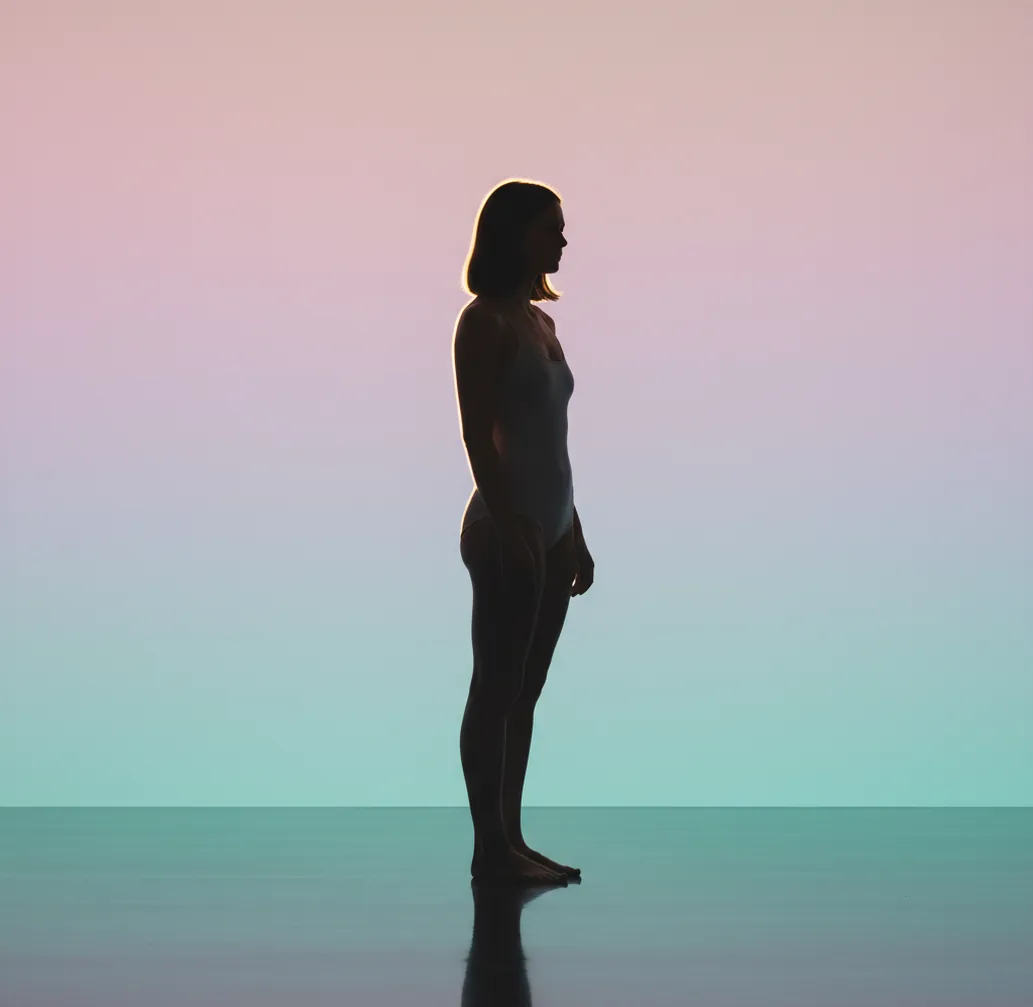 Portrait photo with smooth pastel gradient background and clean edge cutout on a neutral backdrop